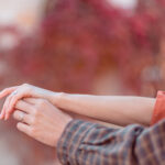 Dreamy romanticised detail photo of couple holding hands during couple photoshoot in Bucharest