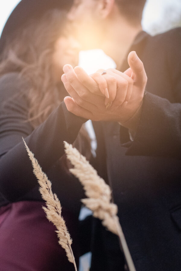 Dreamy romanticised couple photoshoot detail of engagement ring near Focsani
